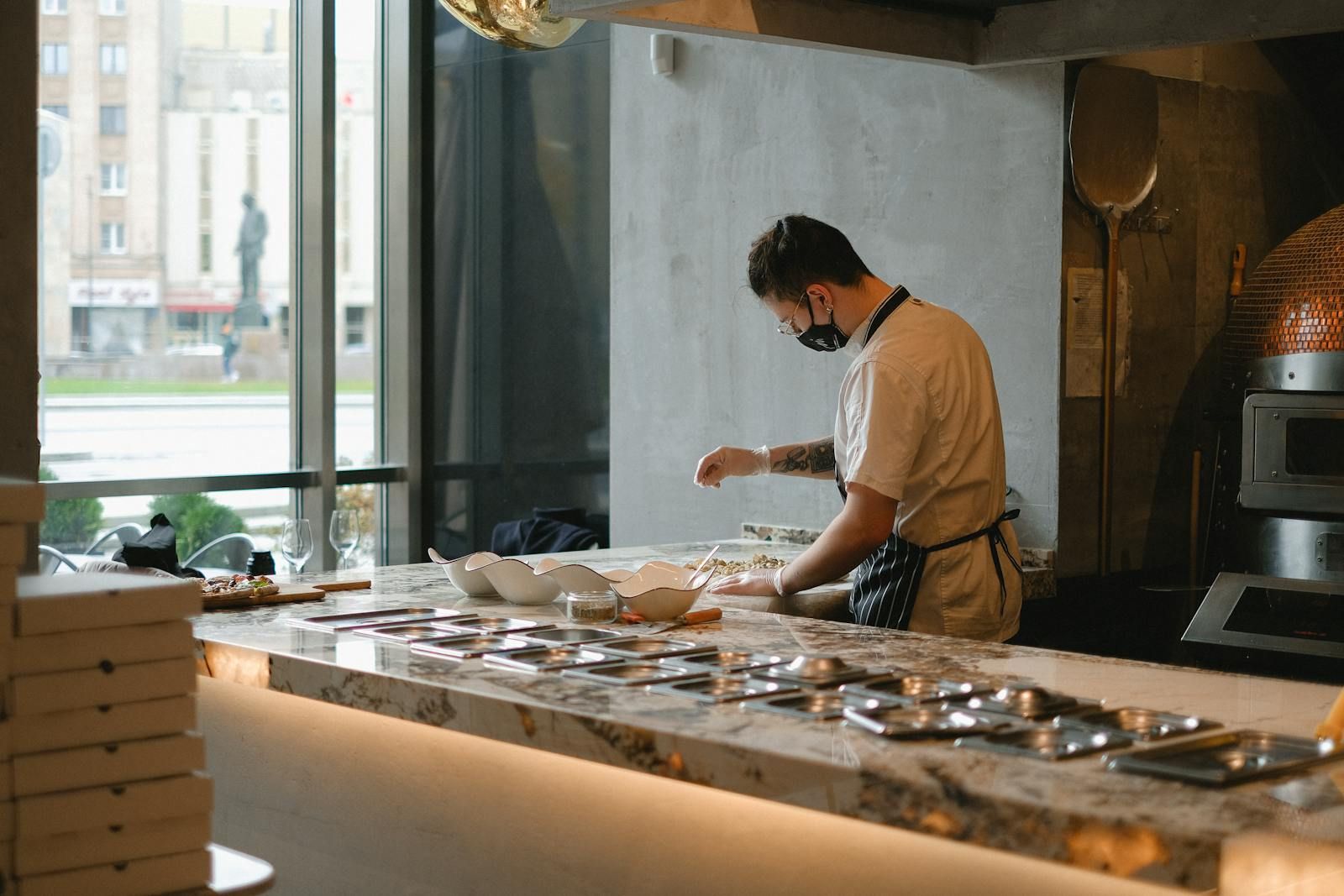 Chef preparing pizza dough in a pizzeria kitchen